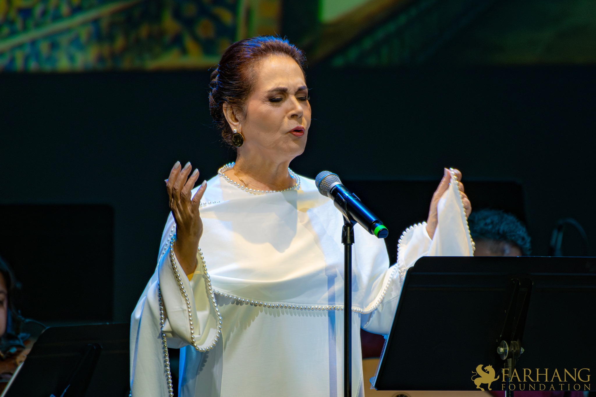 Parissa in performance at a Farhang Foundation Nowruz concert — grayscale duotone treatment