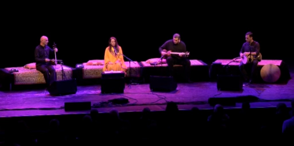 Parissa with Meshk Ensemble on stage at the Barbican Centre, London — Rumi anniversary concert, kamancheh, tar, and tombak, 2016