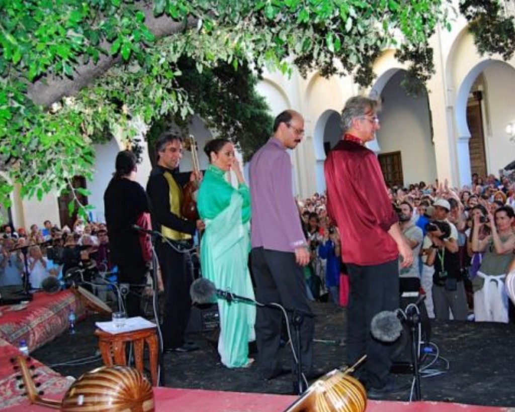 Parissa and Dastan Ensemble on stage at the Batha Museum courtyard — Barbary oak overhead, horseshoe arches, Fes Festival of World Sacred Music, June 2007